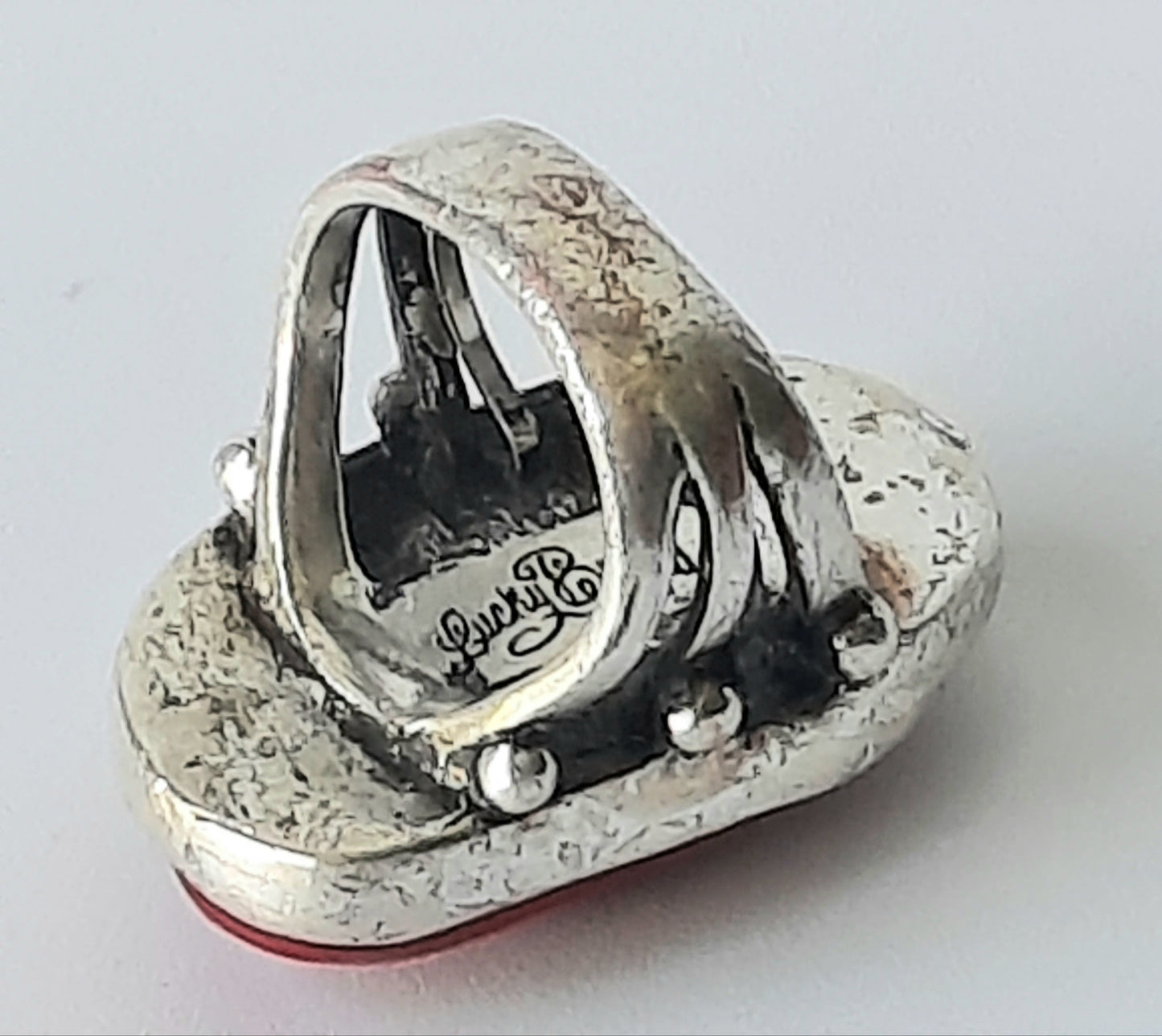 "Lucky Brand" Silver Toned Red Stone Ring Size 8 adjustable to smaller size.